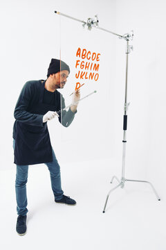 Street Artist Working In Studio On Typography