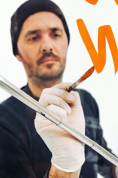 Street Artist Working In Studio On Typography