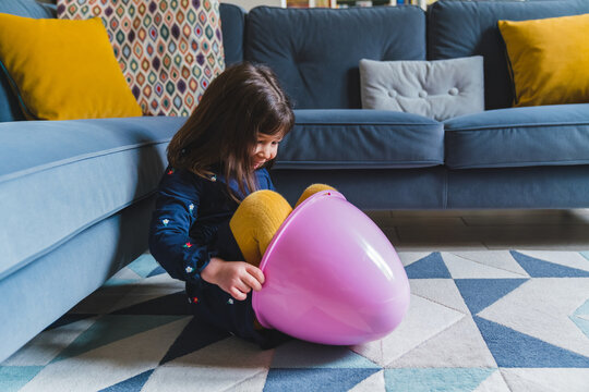 Little Girl Hiding in an Easter Egg