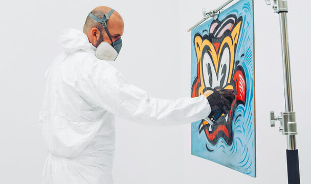 Street Artist Working In Studio On Typography And Graffiti Illustrations