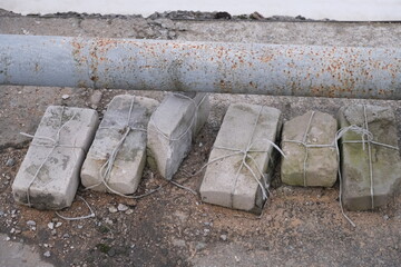 white bricks tied with rope