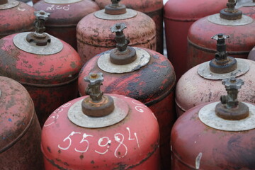 old rusty red propane tanks