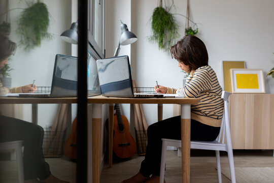 kid sitting on desk studying 