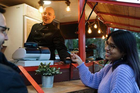 Couple paying for their food