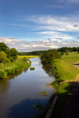 Fototapeta na wymiar Aln river near Alnwick, Northumberland, England, in spring