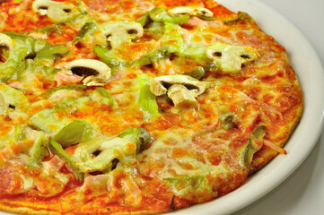 Pizza closeup view on white plate