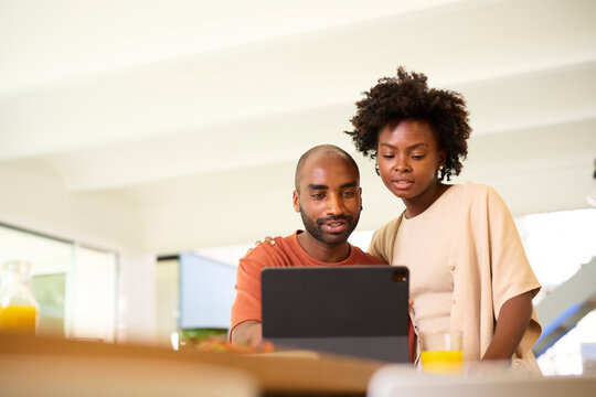 Couple watching at tablet together.