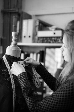 Woman fashion designer working in her sewing atelier