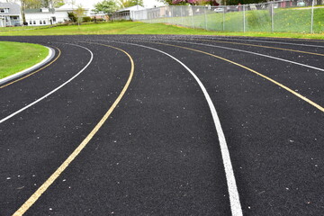 Athletic or running track with striped for lanes.
