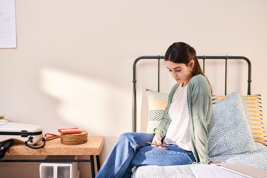 Girl reading ebook on mobile.