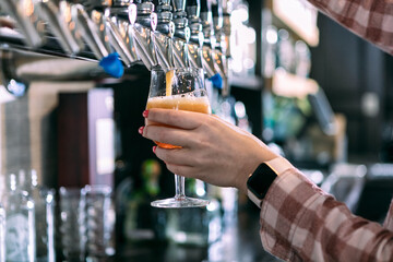 Brewery: Bartender Pulls An IPA From Tap