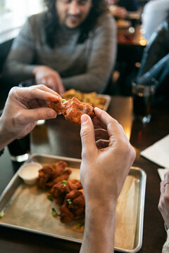 Brewery: Male Customer Ready To Eat Chicken Wings