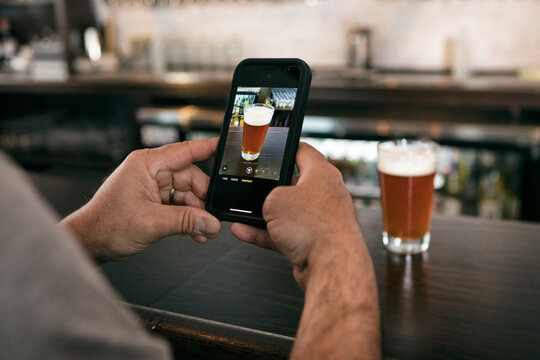 Brewery: Man Takes Photo Of Beer For Social Media