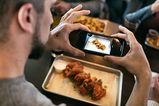 Brewery: Guy Takes Photo Of Chicken Wings With Smart Phone