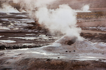 geyser giving off smoke.