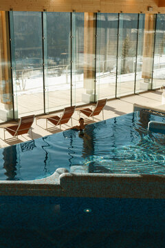 Young woman relaxing Inside the spa pool