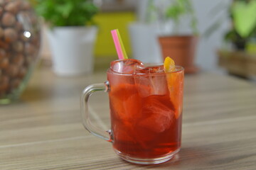 homemade cocktail on the wooden table closeup on kitchen blurred background