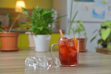 homemade cocktail on the wooden table closeup on kitchen blurred background