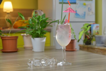 homemade cocktail on the wooden table closeup on kitchen blurred background