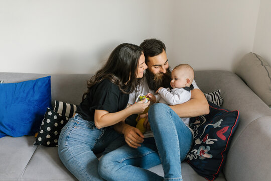 Family lifestyle, young millennial parents spending free time with their baby