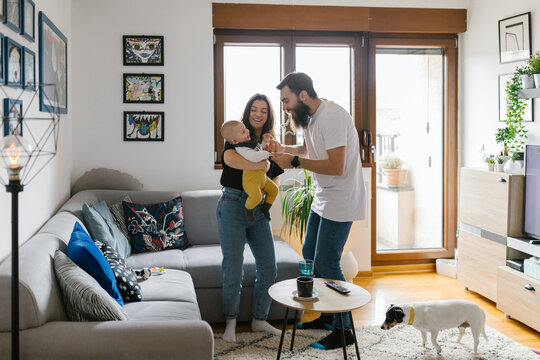 Family lifestyle, young millennial parents spending free time with their baby