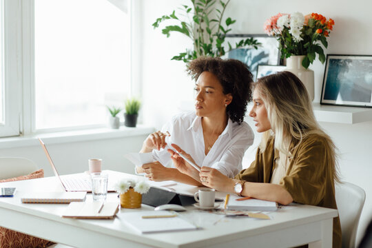 Women Working On Their Project 