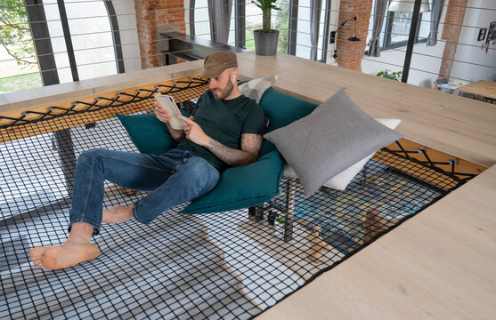 Man relaxing on a loft net