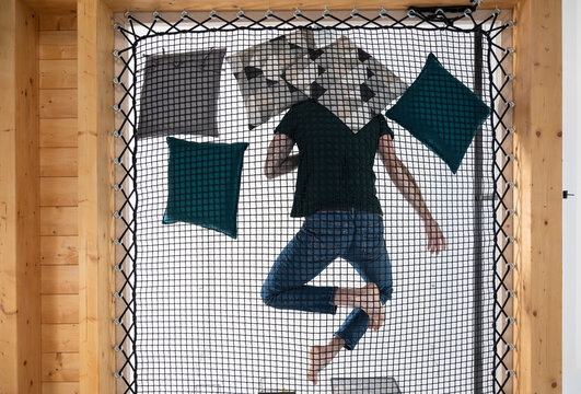 Man relaxing on a loft net