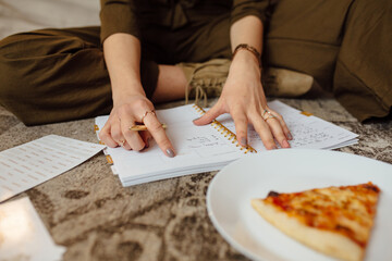 Close Up Woman Organizing Her Assignments 