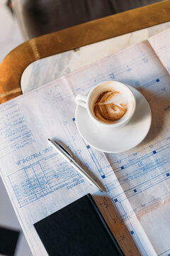 Coffee and Documents on Table