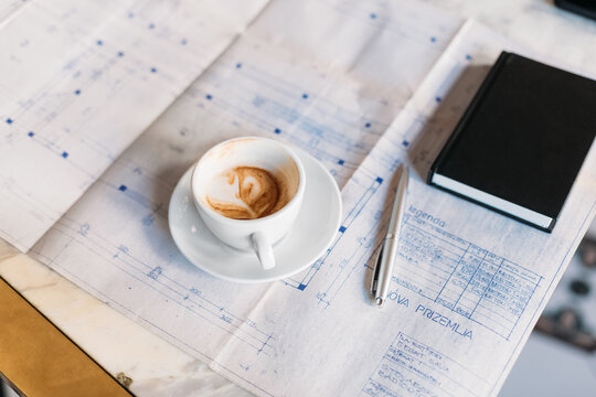 Coffee and Documents on Table