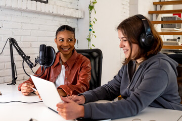 Two colleagues recording an online podcast