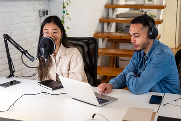 Diverse colleagues recording an online podcast  