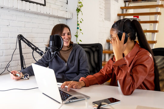 Diverse colleagues recording an online podcast - Powered by Adobe