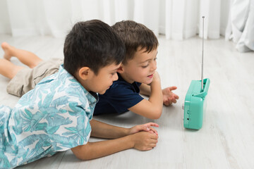 Boys listening to the radio