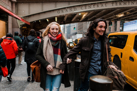 Happy couple in the snow at Grand Central Terminal