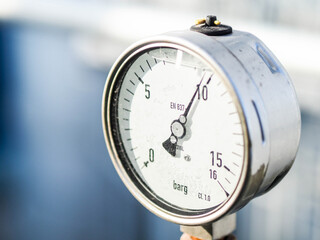 Pressure gauge of measuring instrument close up in industry zone at power plant with closed up
