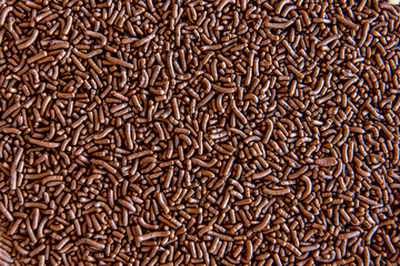 Chocolate sprinkles texture background.