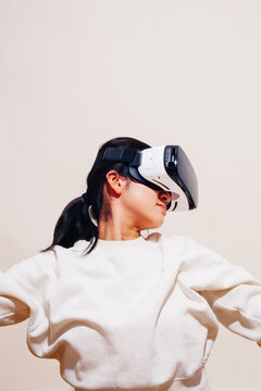Young Woman With Occulus VR Headset In Studio