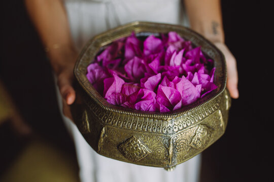 A bowl full of violet petals