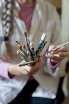 Senior woman Painting in your home