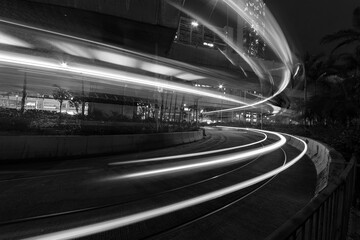 light trails of traffic in downtown of Hong Kong city at night. Traffic background