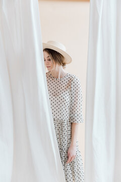 Girl in a Polka Dot Dress and Hat