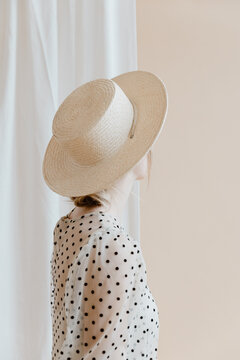 Girl in a Polka Dot Dress and Hat