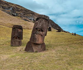 Easter Island's Moai site many stone heads sticking out from the ground