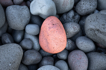 Smooth pink rock on the beach. Amed. Bali.  Indonesia.