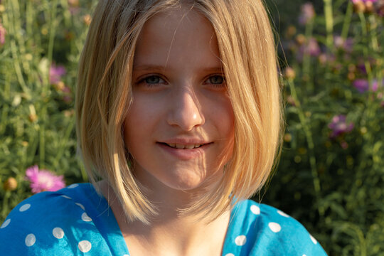 Portrait of a beautiful, blonde  girl outdoors 