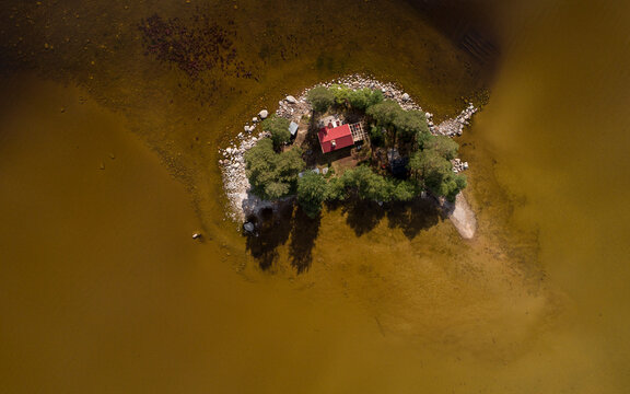 Aerial of small island with lonely house