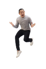 Asian man wearing grey shirt black denim and white shoes, jump while screaming shouting celebrating...