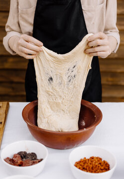 woman chef prepares pizza dough